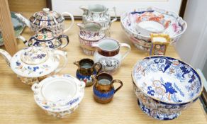 A group of 19th century English ceramics to include -three teapots and covers, five jugs, two