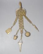 A Continental pierced gilt metal chatelaine hung with five accoutrements, 32cm