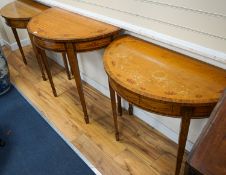 Three Sheraton style painted satinwood demi lune console tables, largest 92cm, width 46cm, height
