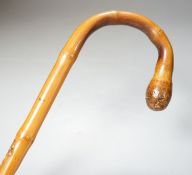A Japanese bamboo 'monkey' walking cane, Meiji period90cm