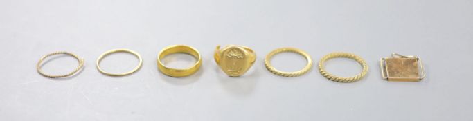 A George V 22ct gold wedding band, 5 grams, a yellow metal signet ring(cut) 8.2 grams and five other