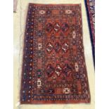 An antique Tekke burgundy ground rug, 150 x 92cm