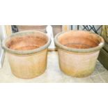 A near pair of large circular terracotta garden planters, diameter 64cm, height 45cm