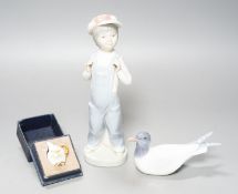 A Lladro figure of a young boy, 21.5cm high, a Royal Copenhagen model a tern, a cased miniature