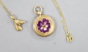 A small early 20th century yellow metal and enamel pendant locket, 18mm, together with a very