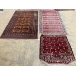 A Bokhara orange ground rug 198 x 125 cms, a smaller Anatolian flat weave rug and Bokhara prayer