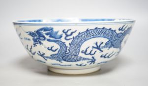 A Chinese blue and white ‘dragon’ bowl, Kangxi mark, late 19th century25cm