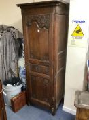 A small provincial French oak armoire, 18th century, width 80cm, depth 58cm, height 203cm