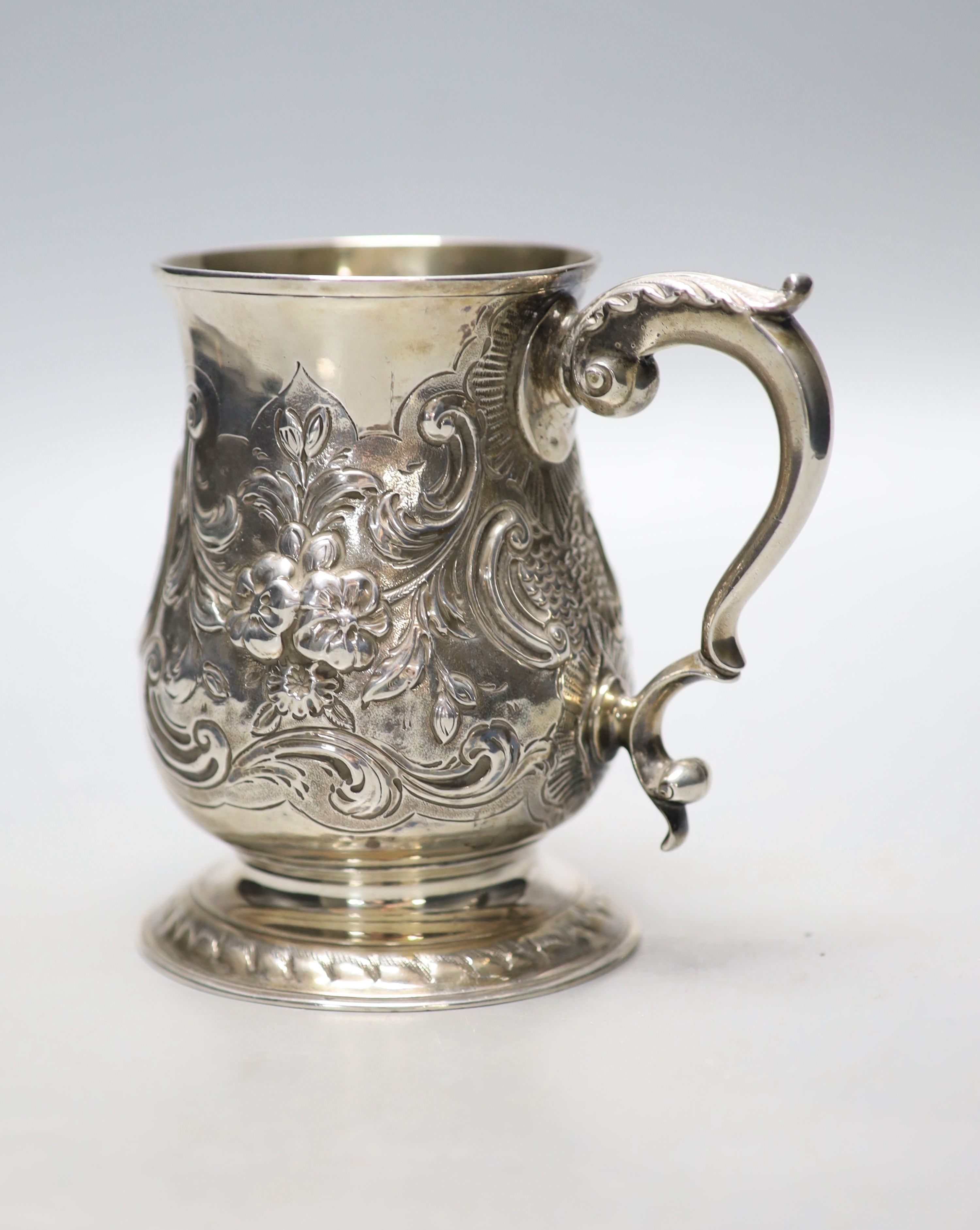 A George III silver baluster mug, with later embossed decoration and later engraved inscription, - Image 3 of 3