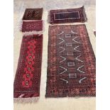 An antique Bokhara rug 170 x 94, Turkoman mat, a Belouch mat and two others.