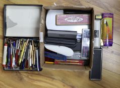 A large collection of pens and pencils, etc.