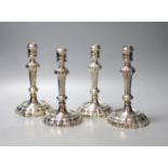 A matched set of four late 18th/early 19th century Italian? cast white metal candlesticks,two marked