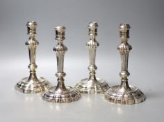 A matched set of four late 18th/early 19th century Italian? cast white metal candlesticks,two marked