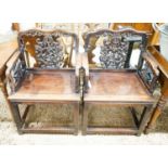 A pair of Chinese carved hongmu elbow chairs (a.f.), width 65cm, depth 48cm, height 96cm