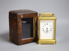 An early 20th century lacquered brass carriage clock, cased