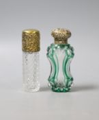 A late Victorina repousse gilt white metal mounted green and clear glass waisted scent bottle,