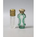 A late Victorina repousse gilt white metal mounted green and clear glass waisted scent bottle,