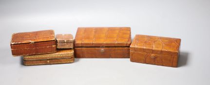 Five assorted boxes including two crocodile skin boxes by Finnigans, early 20th century, largest