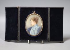 A late Victorian cased oval miniature on ivory, signed Elliott & Fry, portrait of a young woman