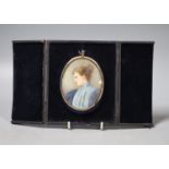 A late Victorian cased oval miniature on ivory, signed Elliott & Fry, portrait of a young woman