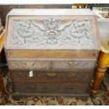 An 18th century later carved oak bureau, width 91cm, depth 53cm, height 101cm