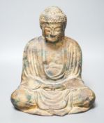 A South East Asian cast iron figure of a seated Buddha28cm