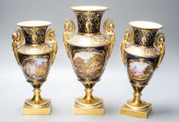 A garniture of three early 19th century English porcelain vases, c.1815-20, each painted with