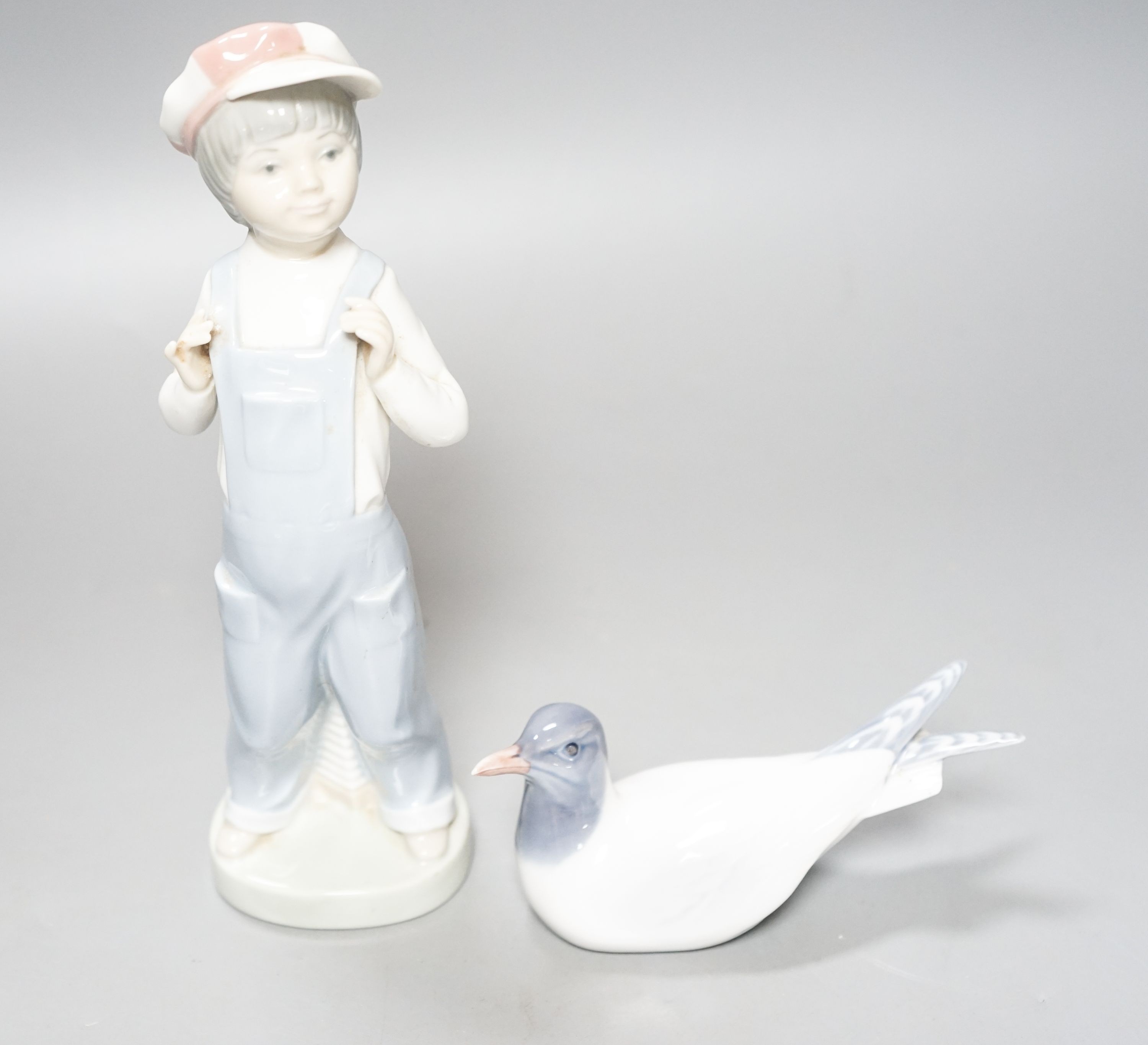 A Lladro figure of a young boy, 21.5cm high, a Royal Copenhagen model a tern, a cased miniature - Image 2 of 2