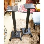 A pair of fluted ebonised plant stands, height 80cm