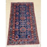 An antique Hamadan blue ground rug, 180 x 104cm