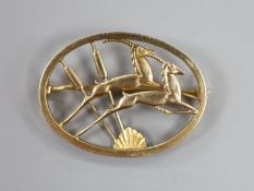 An Ivan Tarratt Ltd Georg Jensen style 9ct gold leaping antelope oval brooch, GT Ltd, Birmingham,