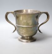 An Edwardian silver two handled trophy cup, with banded girdle, Robert Dicker, London, 1904,