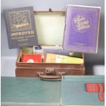 Four stamp albums and a small case containing loose stamps