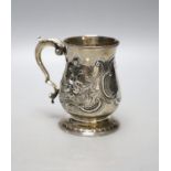 A George III silver baluster mug, with later embossed decoration and later engraved inscription,