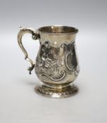 A George III silver baluster mug, with later embossed decoration and later engraved inscription,