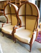 A pair of Victorian style upholstered carved mahogany hall porter's chairs, width 80cm, depth