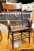 An early 20th century American elm and beech comb back armchair, width 57cm, depth 48cm, height