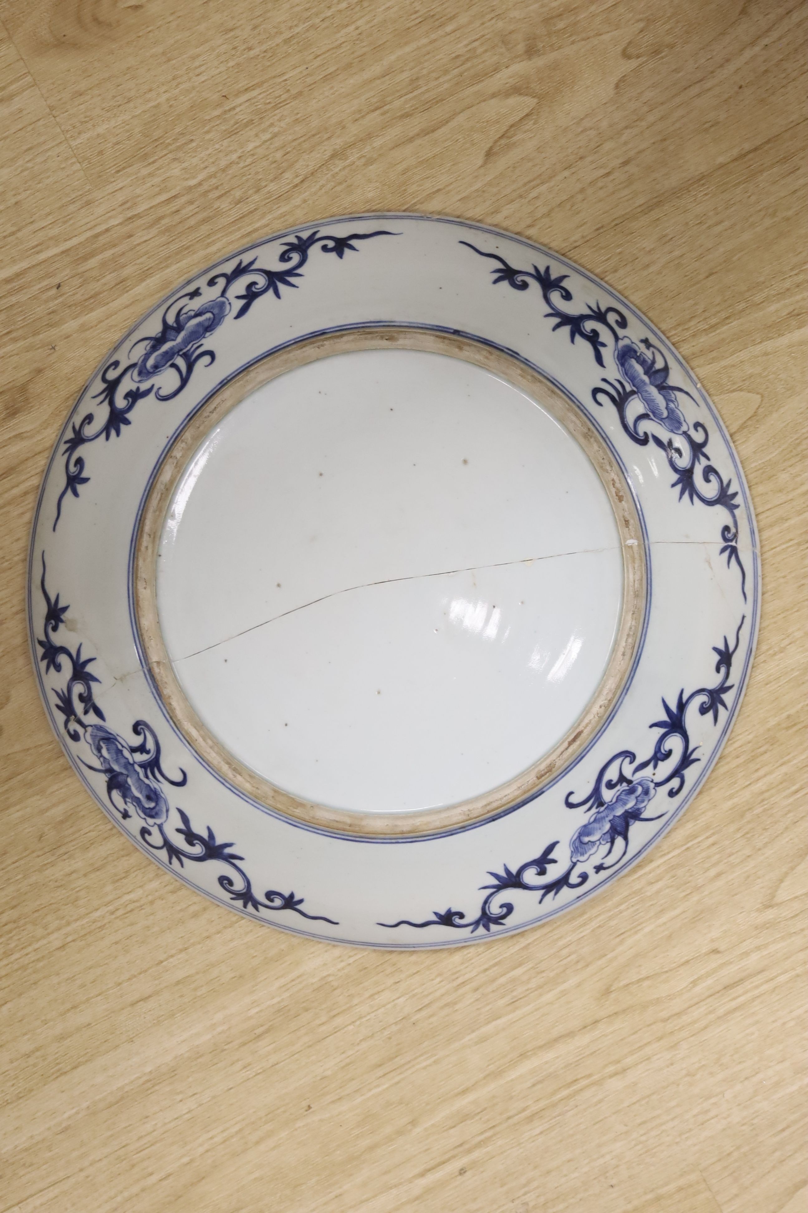 A large Chinese blue and white 'lotus and eight Buddhist emblems' dish, Daoguang period, repaired. - Image 3 of 3