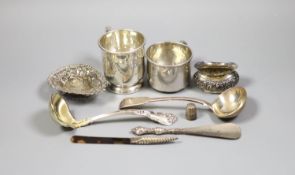 Mixed silver and sterling items including two mugs, two sauce ladles, salt thimble, nut dish and two