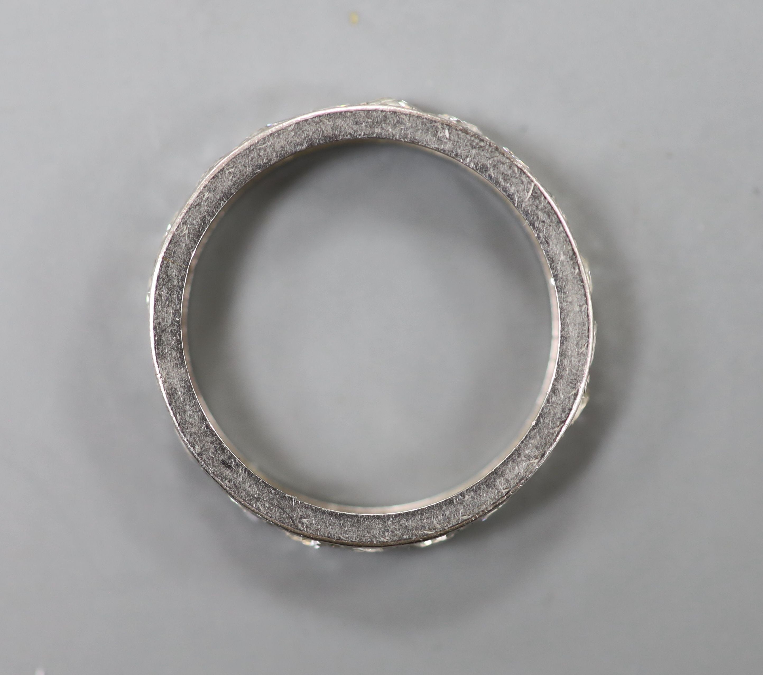 A white metal and diamond set full eternity ring, size K/L, gross 2.5 grams. - Image 2 of 2