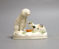 A Staffordshire porcelain group of a poodle and a cat, c.1830-50, 11 cm longProvenance - Dennis G.