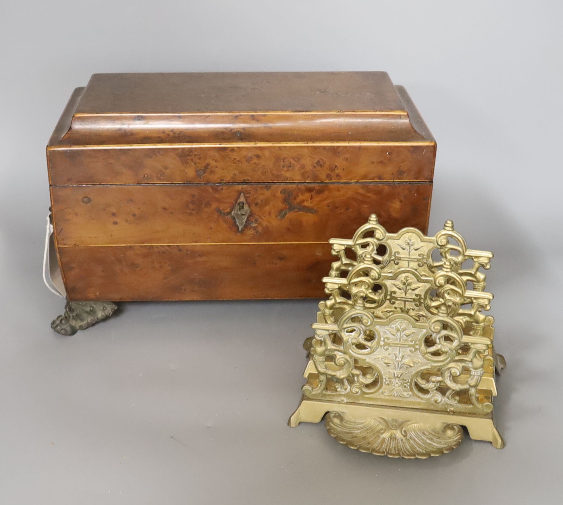 A late Georgian burr yew tea caddy, on gilt metal lion’s paw feet (lacking interior), 31 x 20cm, and