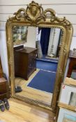 A 19th century French overmantel mirror, giltwood and gesso with channelled frame and scroll with