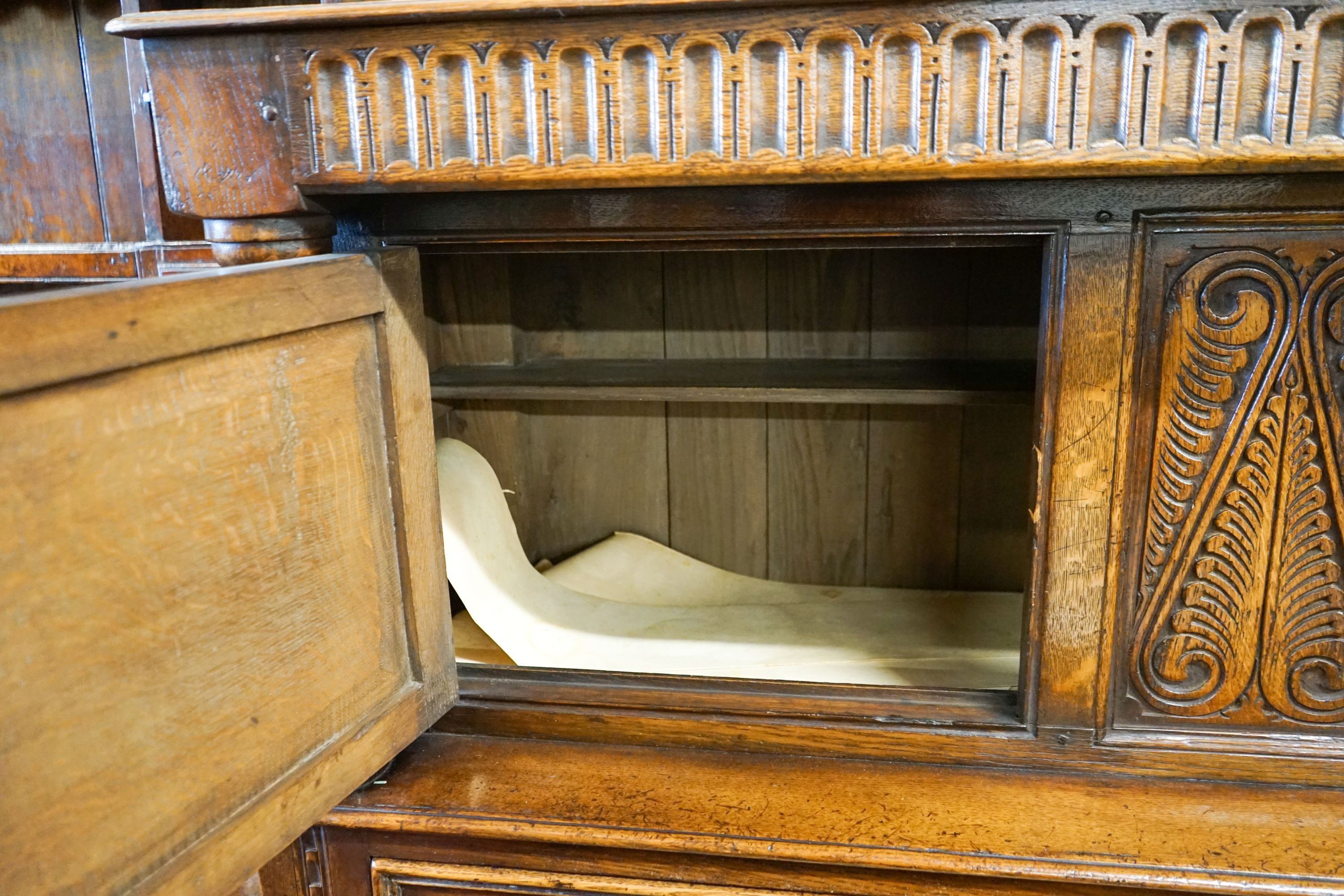 A 17th century style carved and panelled oak court cupboard,on turned supports, length 145cm, - Image 4 of 4