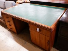 A mid century design teak kneehole desk, bears a Waring & Gillow stamp, length 168cm, depth 106cm,