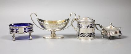 A George III silver two handled boat shaped pedestal salt, London, 179, one other salt and two later