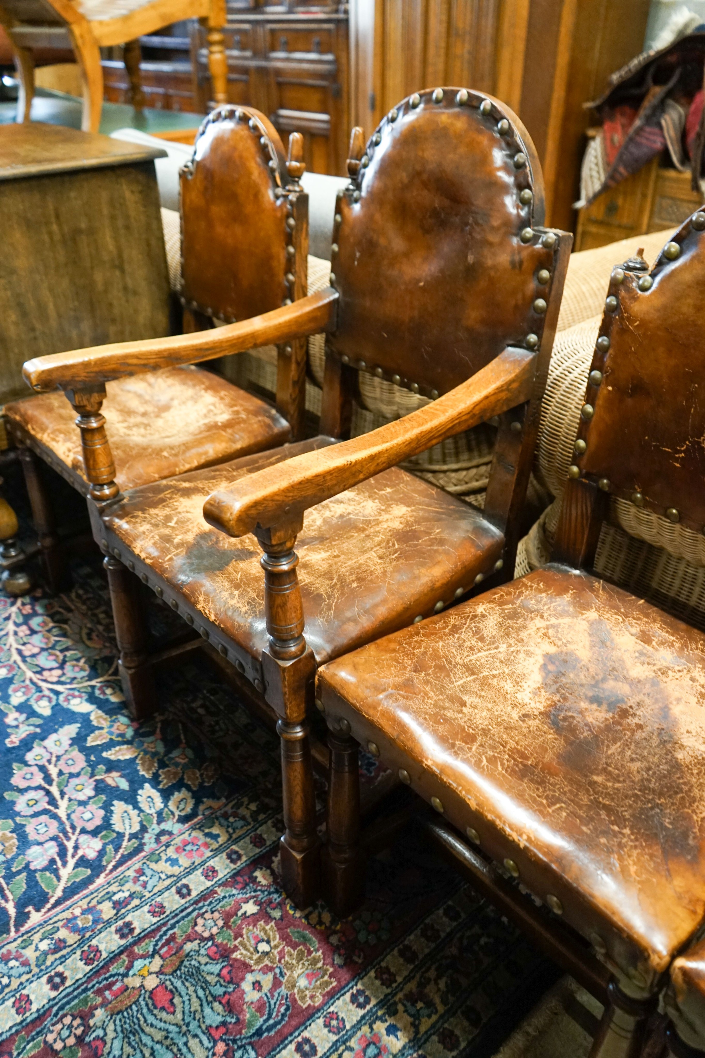 A set of six oak dining chairs,having arched backs and brass-studded brown leather upholstery (two - Image 4 of 4