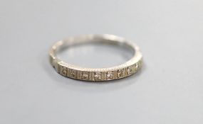 A modern 18ct white gold and diamond chip set half eternity ring. size Q, gross weight 2.5 grams.