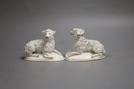 A pair of Staffordshire porcelain models of a recumbent ram and ewe, c.1830-50, 9.6 cm - 9.9 cm