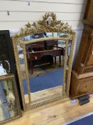 A 19th century giltwood and gesso overmantel mirror with Olympic Torch & Laurel Crown, side cushions